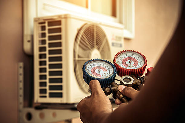 Professional Heat Pump Repair technician working in Puxico, MO
